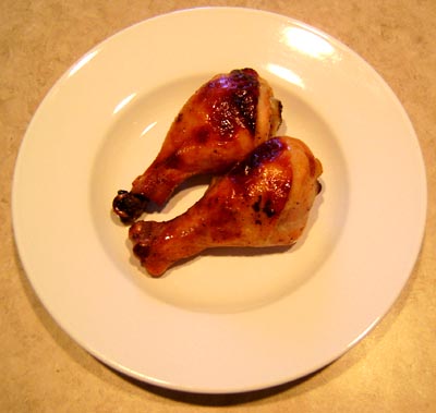 two pieces of honey mustard place on a white plate.