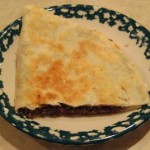 quarter cut beef quesadilla in plate