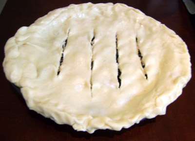 Cut the slits in the top crust of blueberry pie