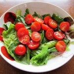 simple salad with lettuce leaves and tomatoes