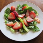 salad with lettuce and sliced strawberries