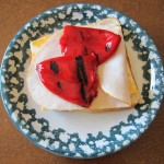 marinated sweet red bell peppers on a sandwich