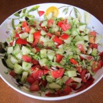 salad with tomatoes, cucumbers and green spring onions scallions