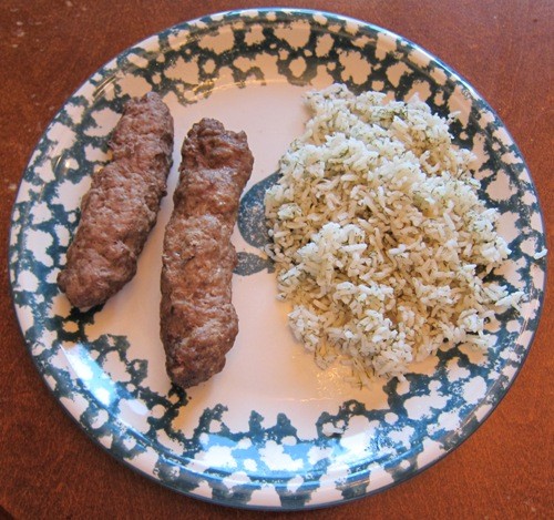 kefta kabob with dill rice on a plate