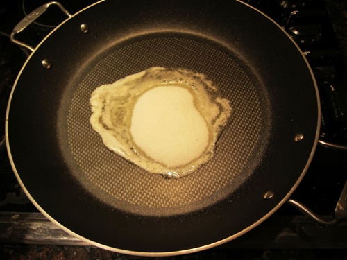 adding sugar to butter on the frying pan