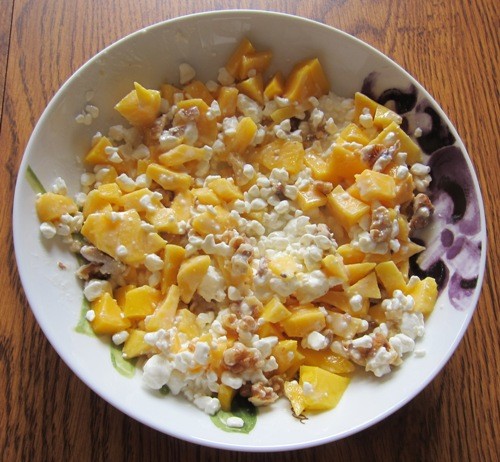 cottage cheese with chopped mango and walnuts
