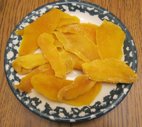 dried mango slices on a plate