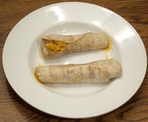 egg cheese and sausage wrap cooked on a plate