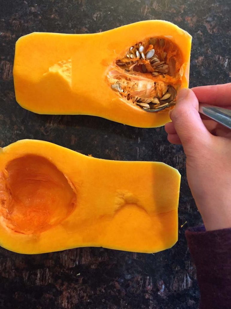 Removing the seeds from butternut squash