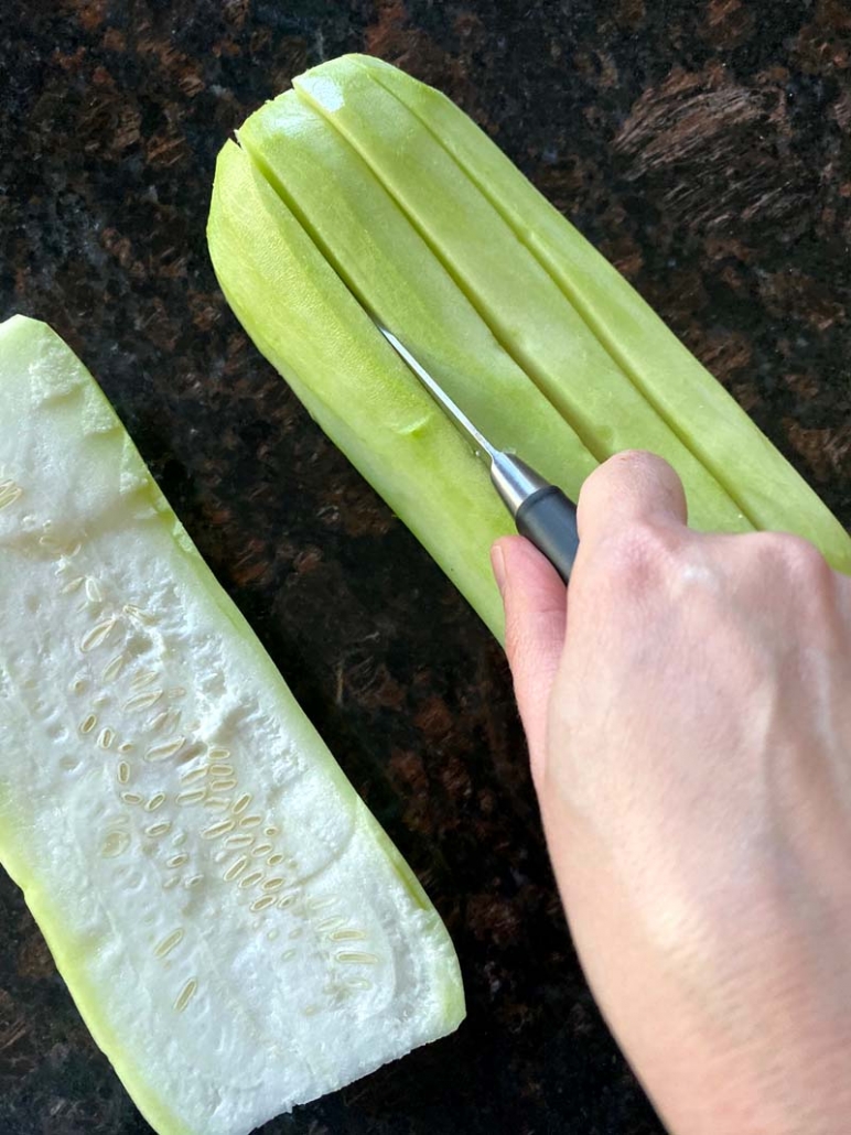 cutting opo squash into cubes