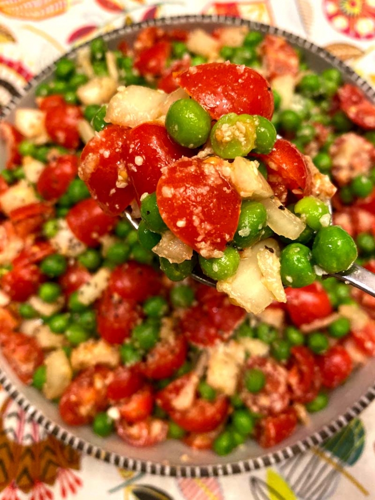 green peas and cherry tomatoes salad with parmesan cheese