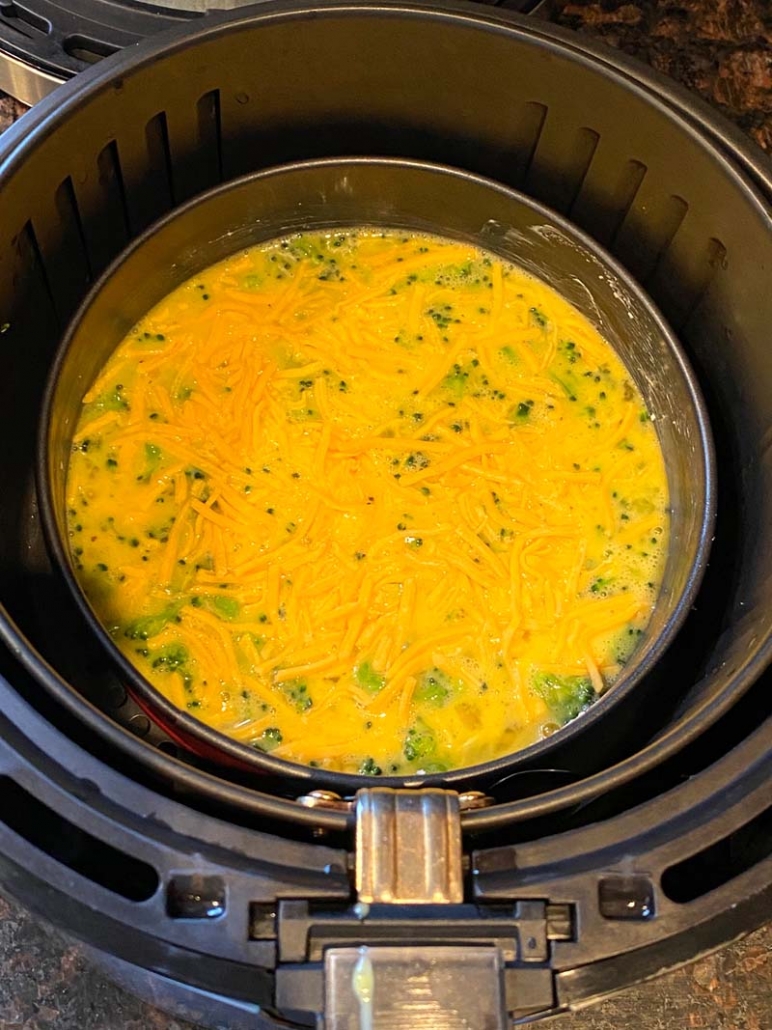 placing the baking dish to cook frittata omelette in air fryer 