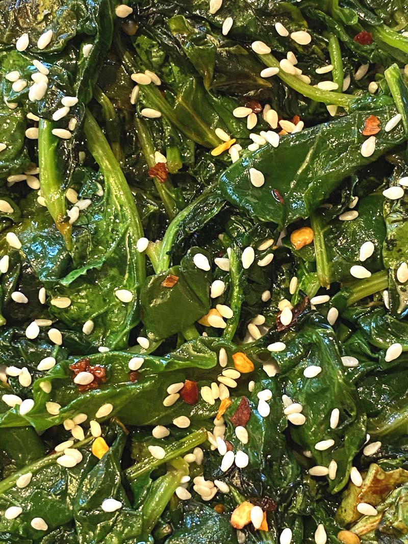 Close up of the cooked kale sprinkled with sesame seeds