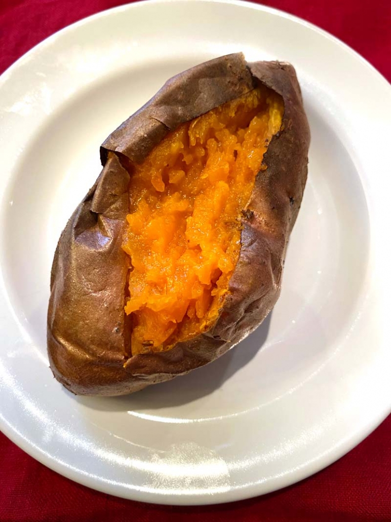 baked sweet potato on a white plate 