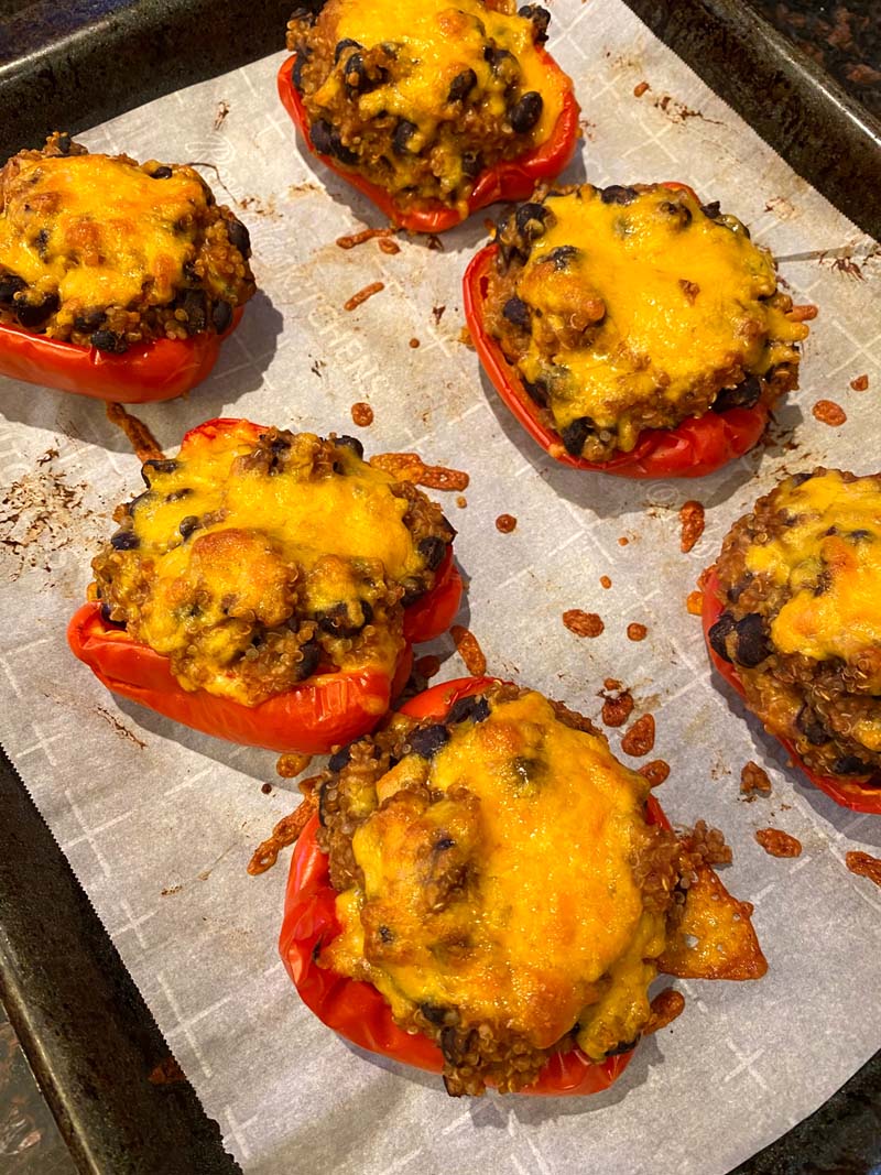 The cooked stuffed peppers on a baking sheet