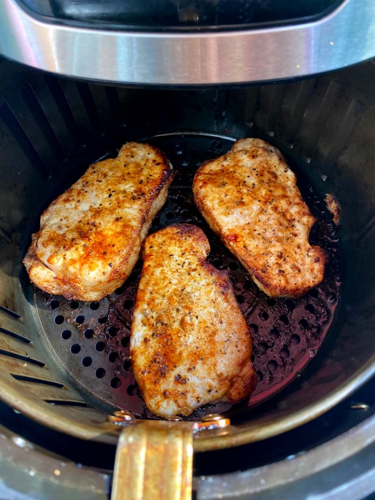 Juicy, fully-cooked pork chops in an air fryer 