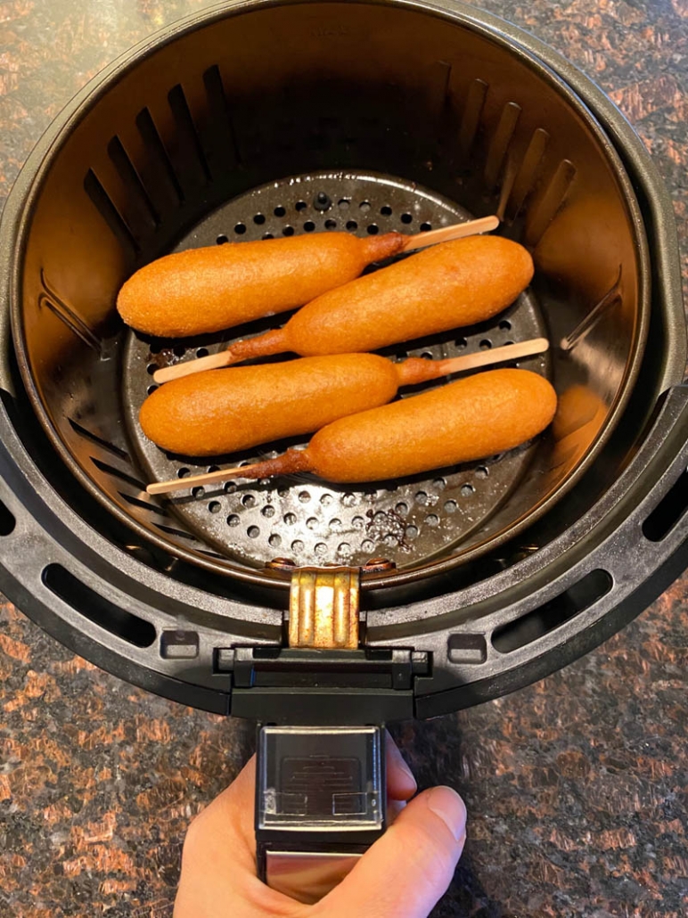 cooked corn dogs in the air fryer basket 