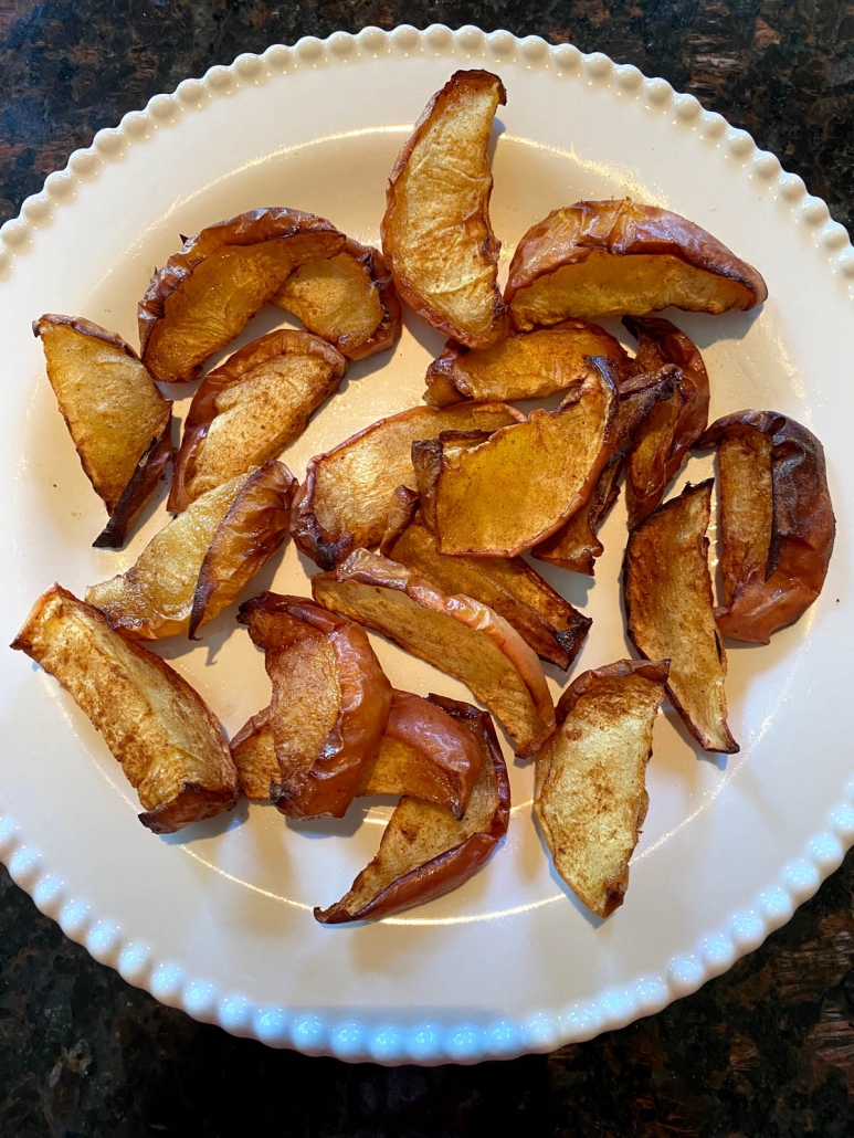 cinnamon apple slices on a white plate 