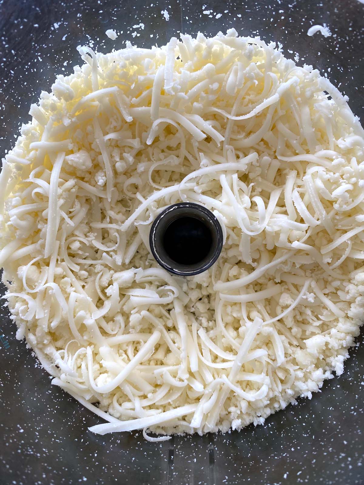 How to Grate or Shred Cheese Without Making a Mess, According to a Recipe  Developer