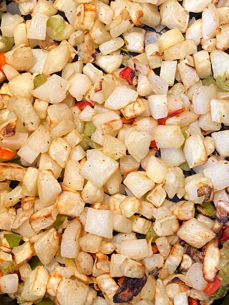 close up of cooked diced potatoes o'brien