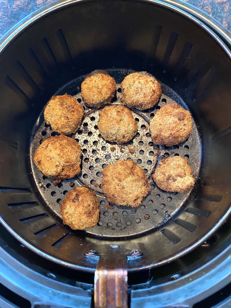 breaded mushrooms cooking in air fryer