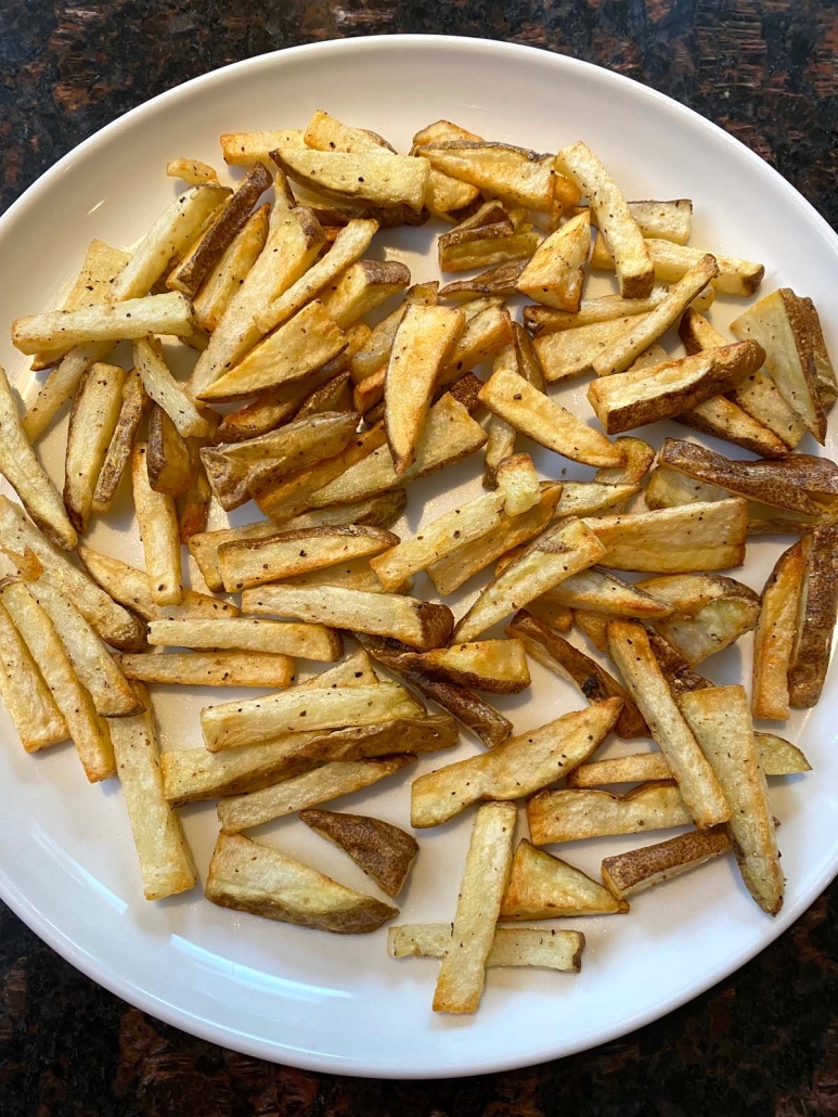 plate filled with cooked french fries