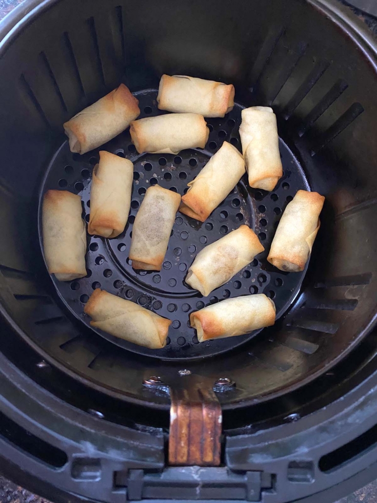 frozen spring rolls inside air fryer basket