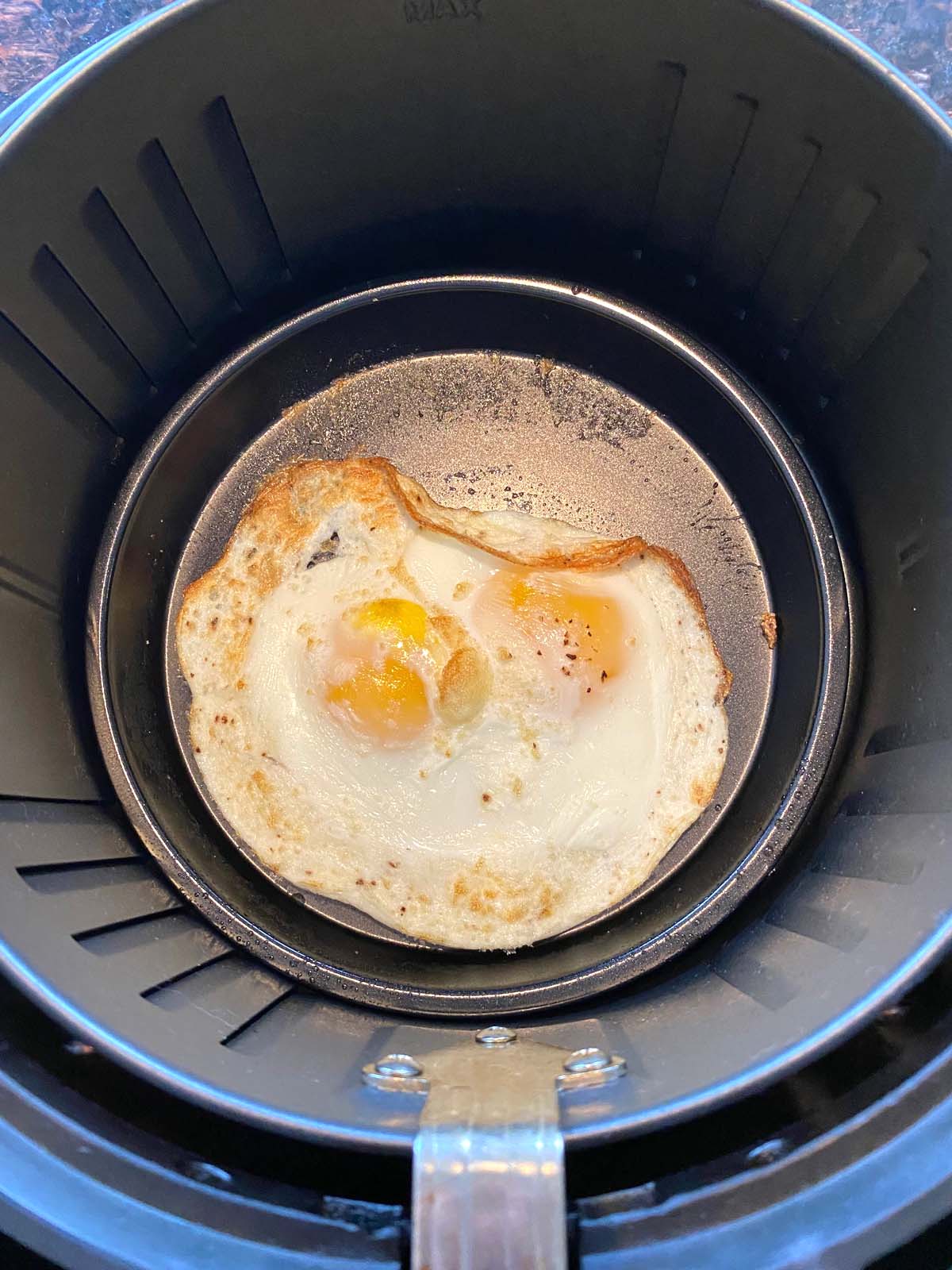 https://www.melaniecooks.com/wp-content/uploads/2022/03/Air-Fryer-Fried-Eggs-4.jpg