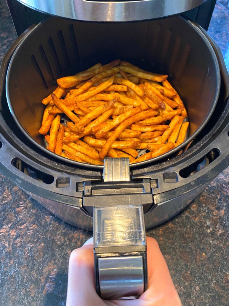 Cooked french fries in an air fryer.