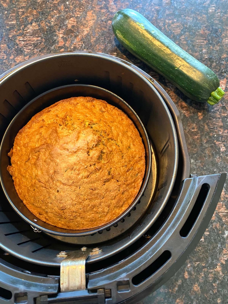 A freshly baked air fryer zucchini bread in the air fryer.