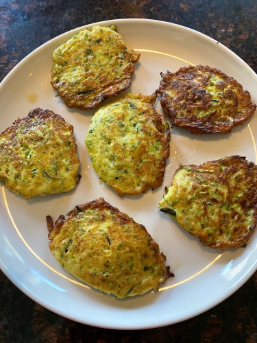 Zucchini pancakes on a plate.