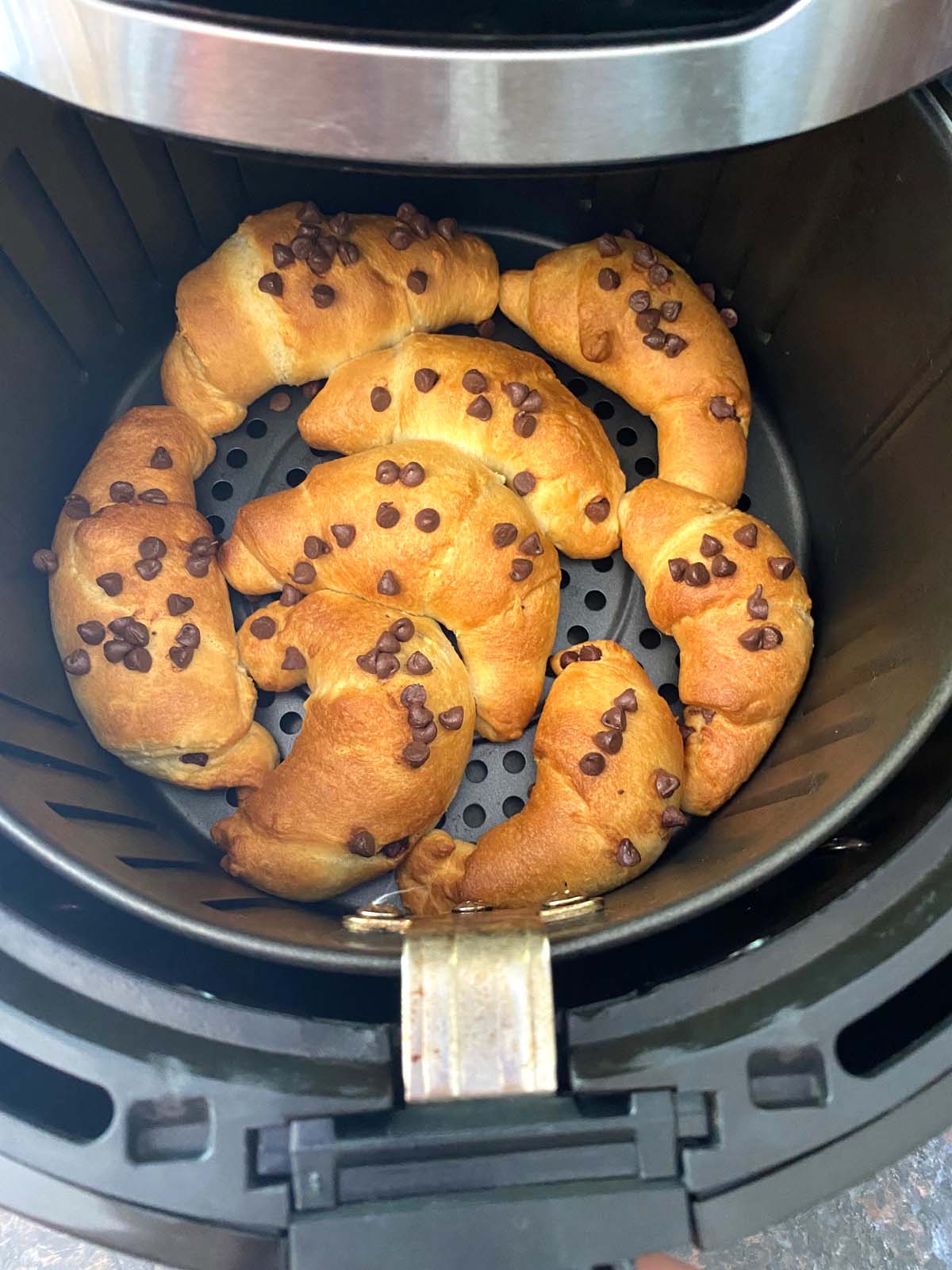 Chocolate croissants in an air fryer.