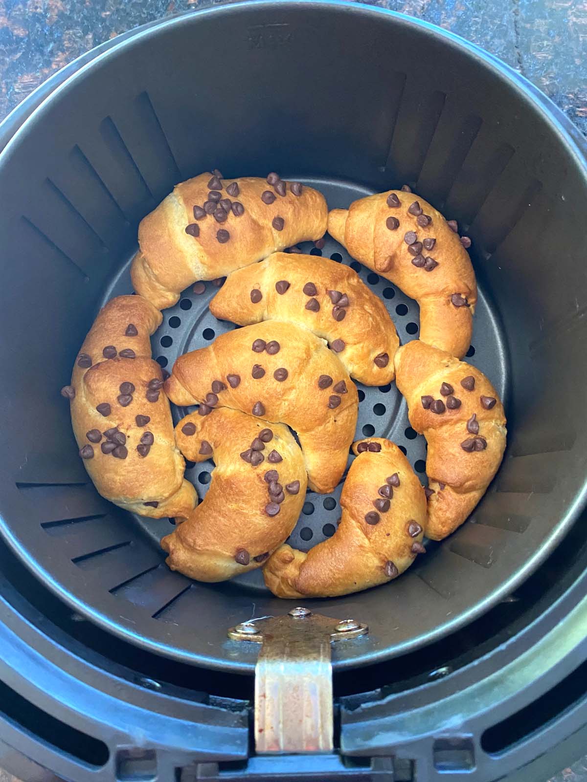 Chocolate croissants in an air fryer.