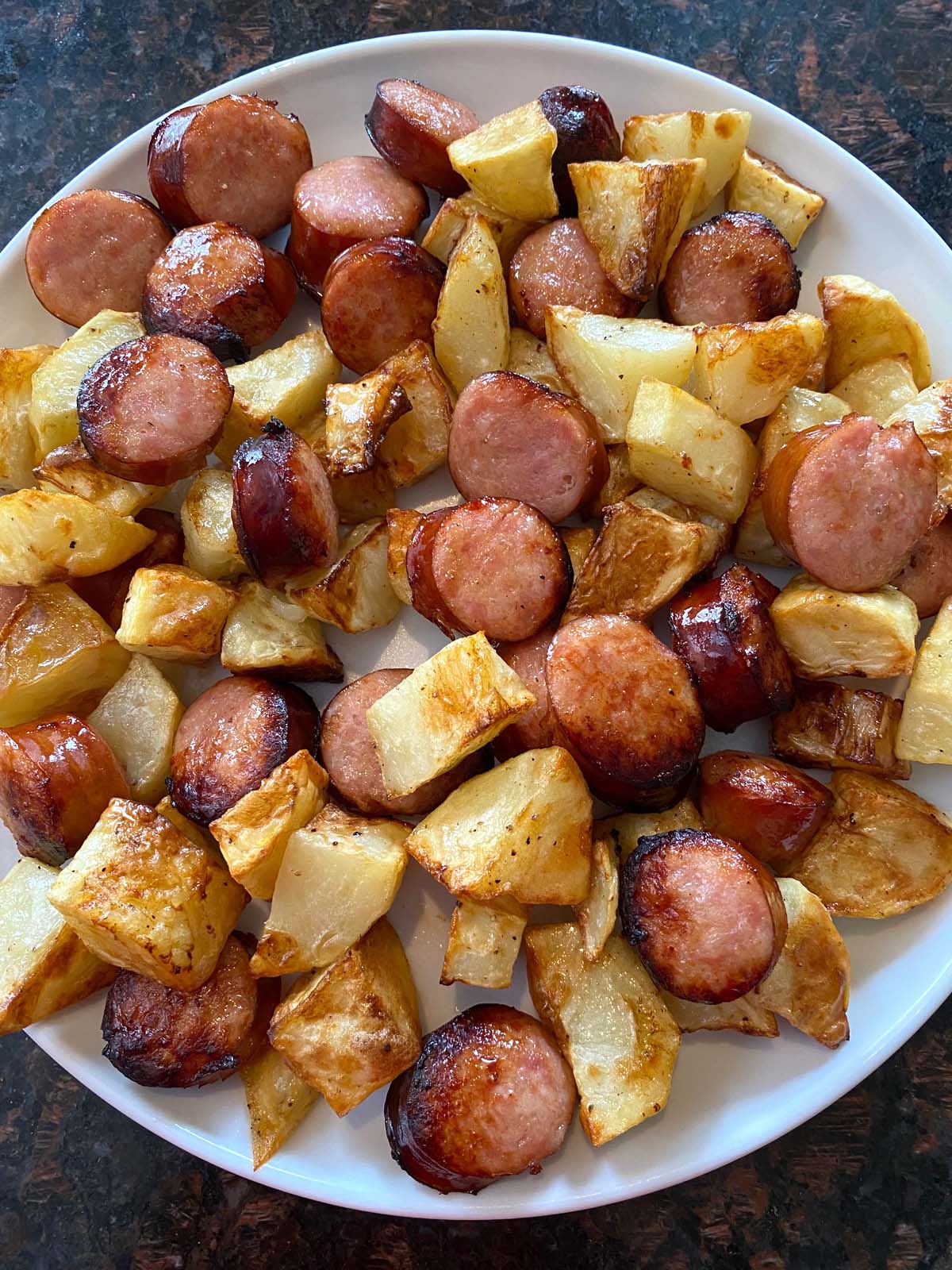 cooked kielbasa and potatoes on a plate