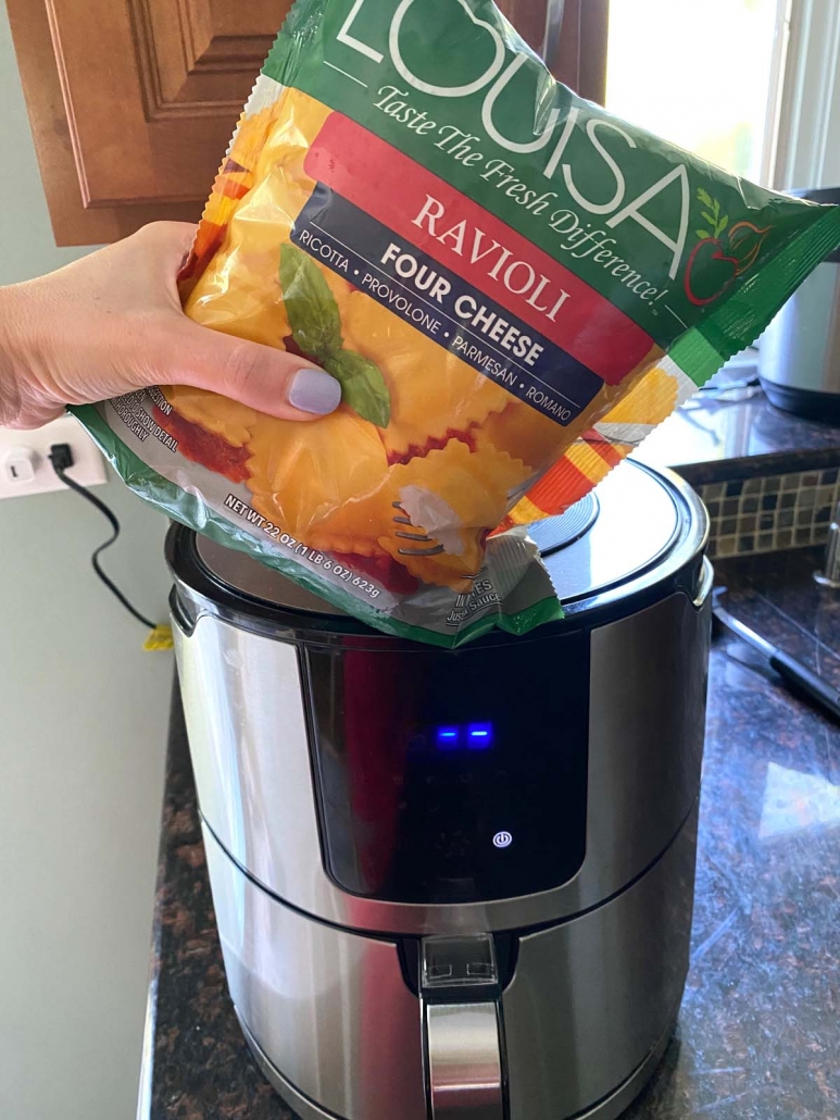 package of frozen ravioli in front of air fryer