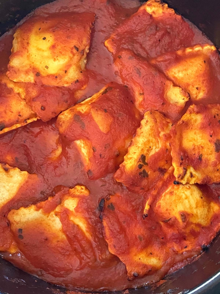 close-up of frozen ravioli cooking in air fryer