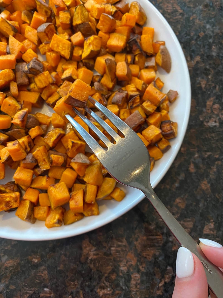 Plate of cooked diced sweet potatoes.