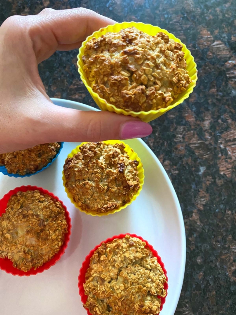 hand holding quick & easy breakfast idea Banana Baked Oatmeal Cups In Air Fryer