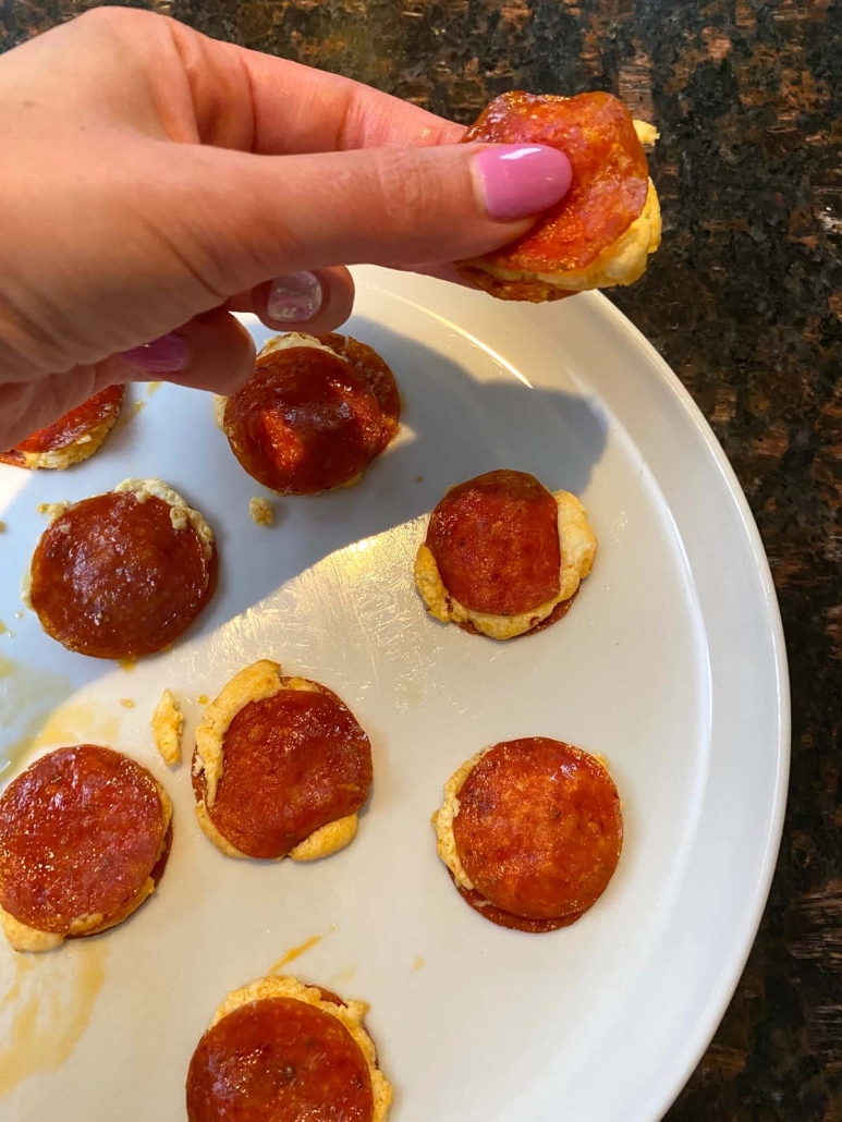 hand holding easy appetizer Pepperoni Cream Cheese Bites