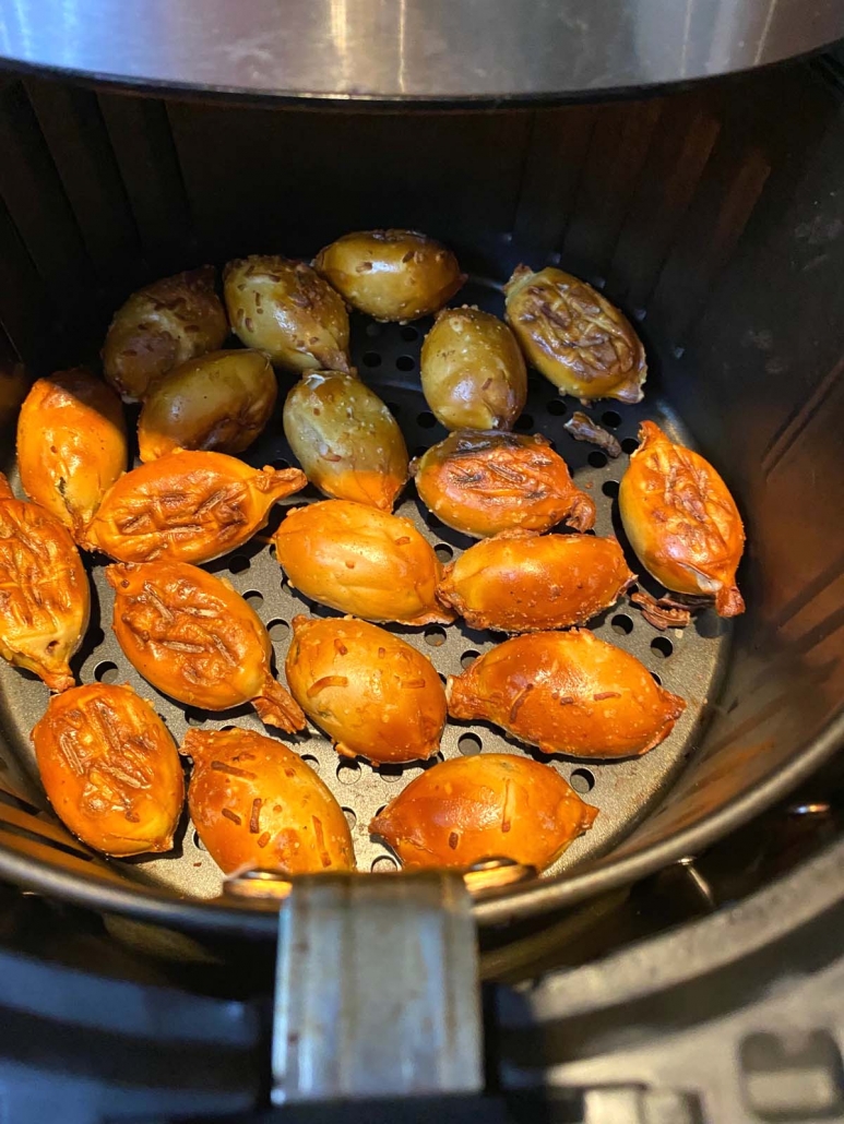 air fryer pretzel bites cooked golden brown in air fryer