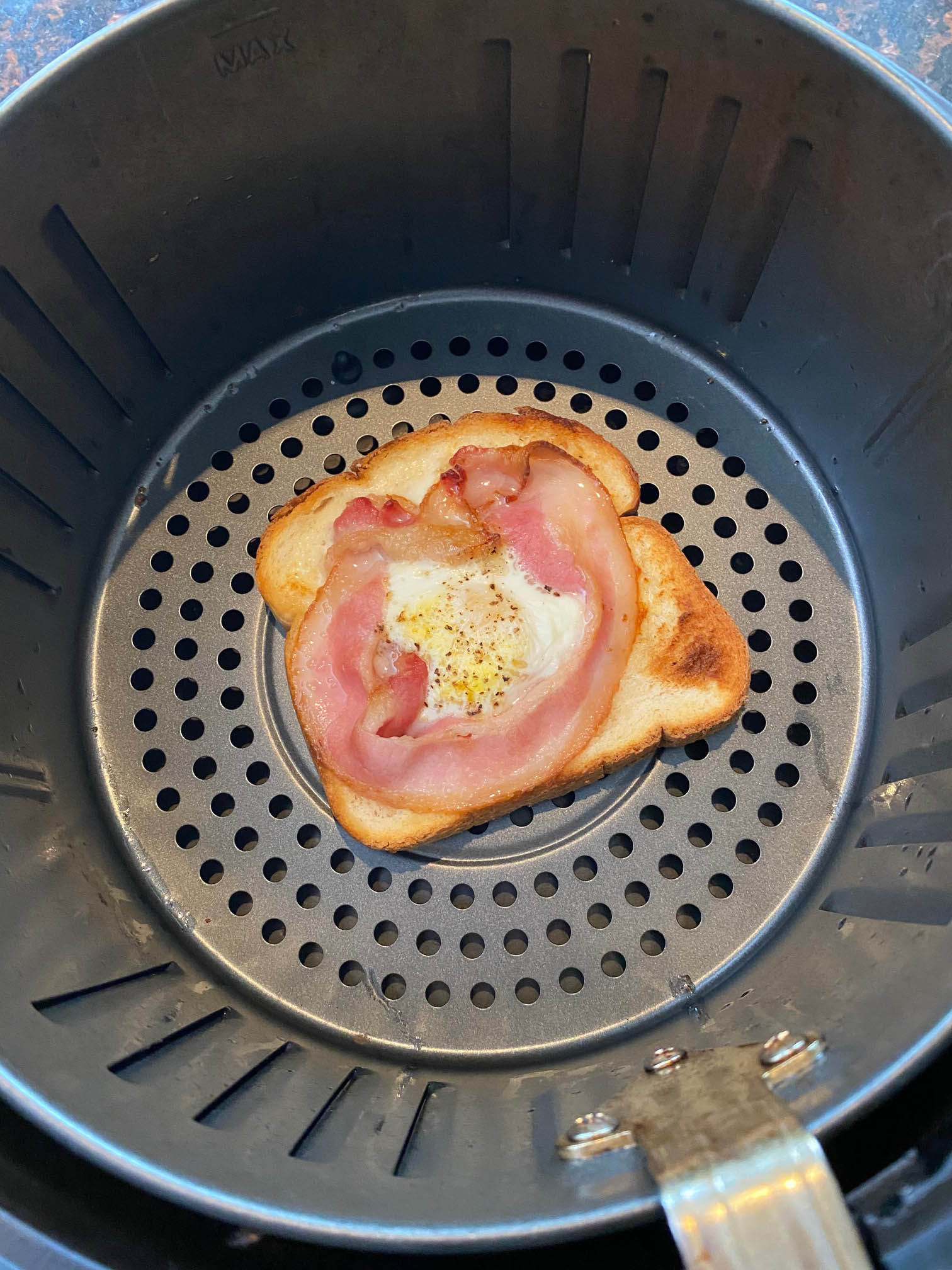 Overhead shot of breakfast recipe in basket of machine.