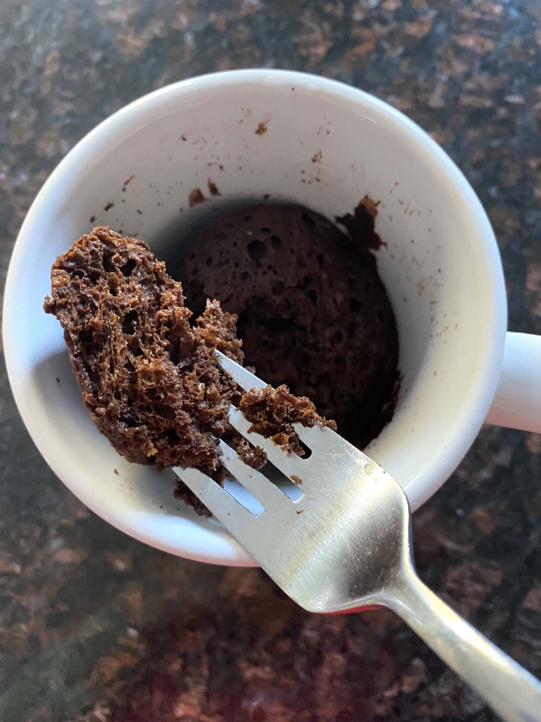 fork holding piece of chocolate mug cake