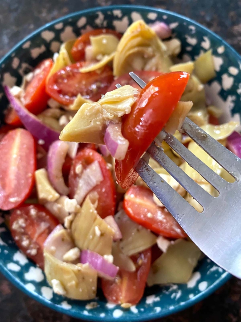 salad bowl of artichoke and tomatoes