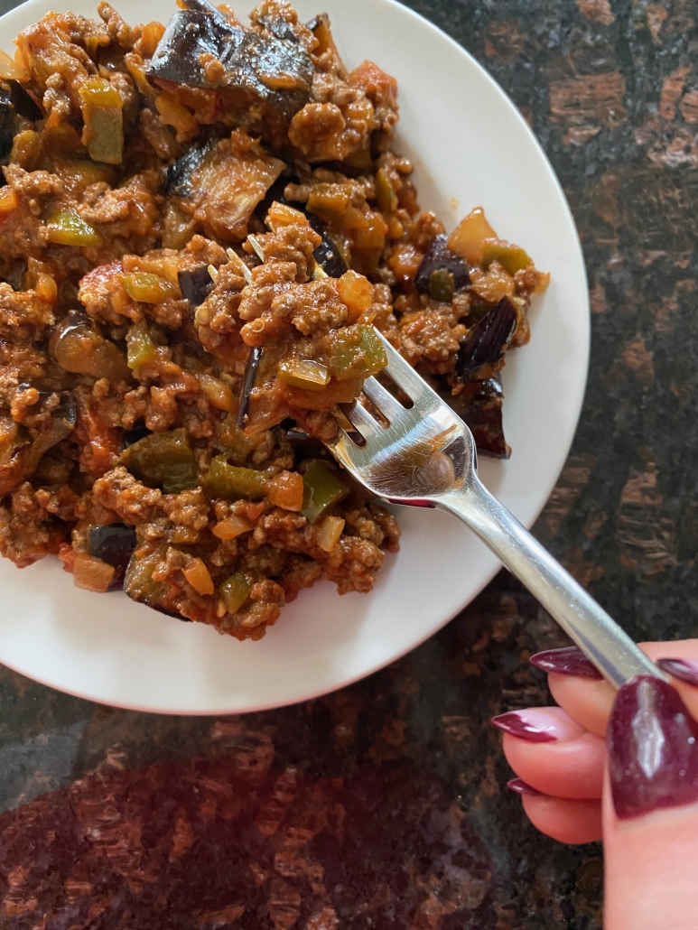 plate of ground beef and eggplant seasoned with salsa