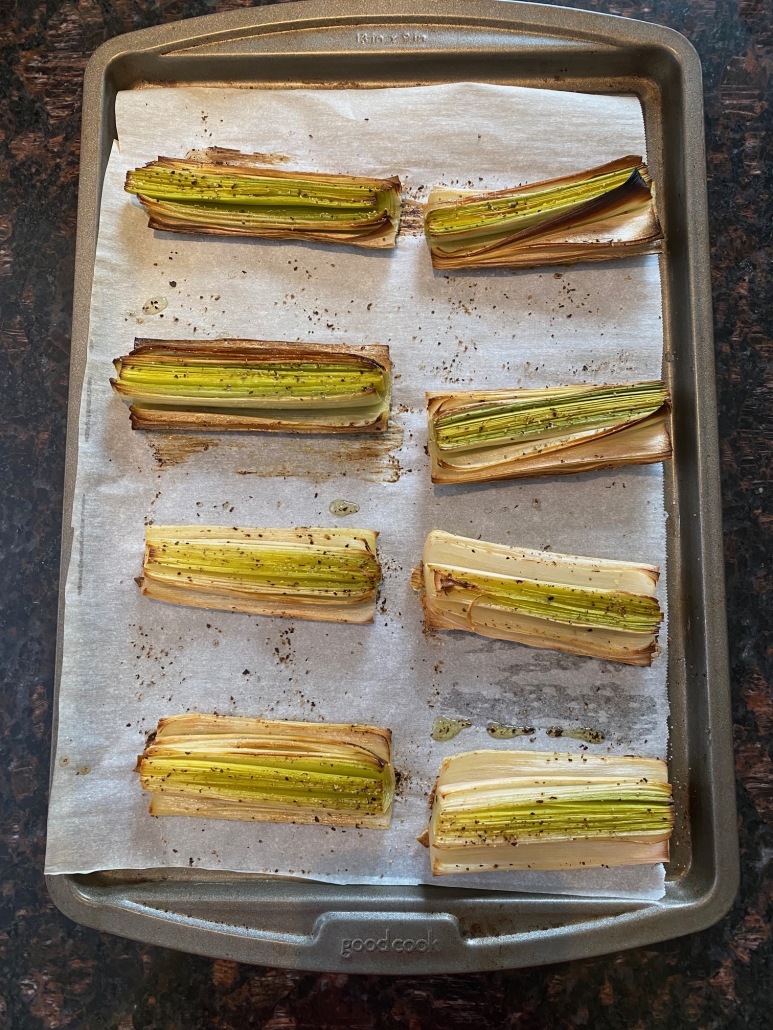 roasted leeks on baking sheet