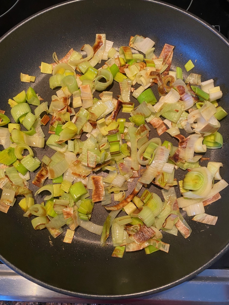 seasoned sautéed leeks in a pan