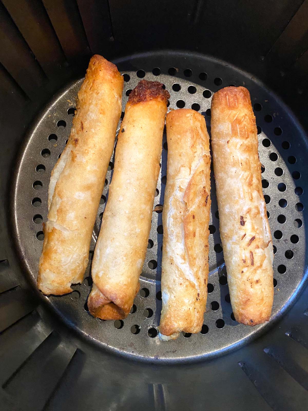 Cooked flautas in an air fryer.