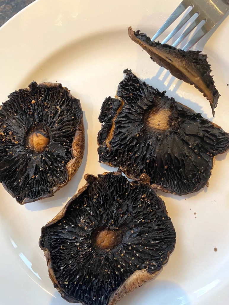 fork holding slice of portobello mushrooms