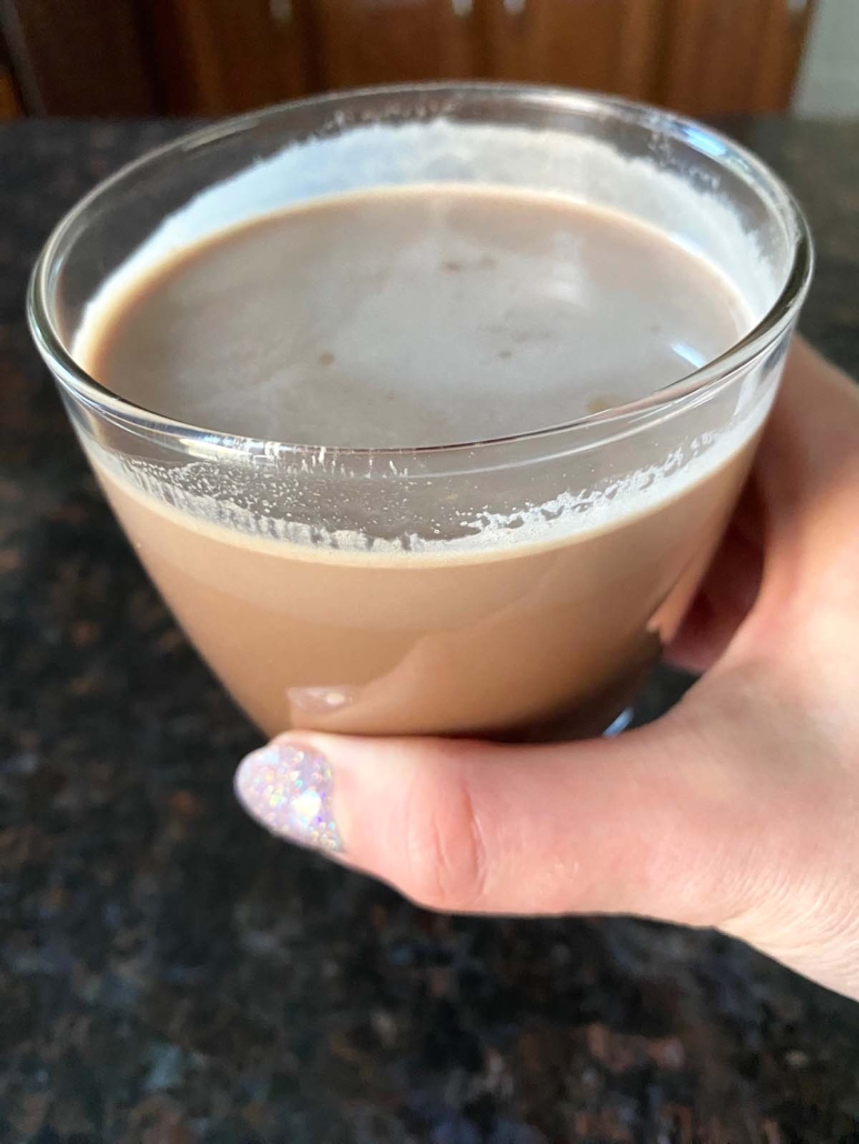 hand holding homemade chocolate milk