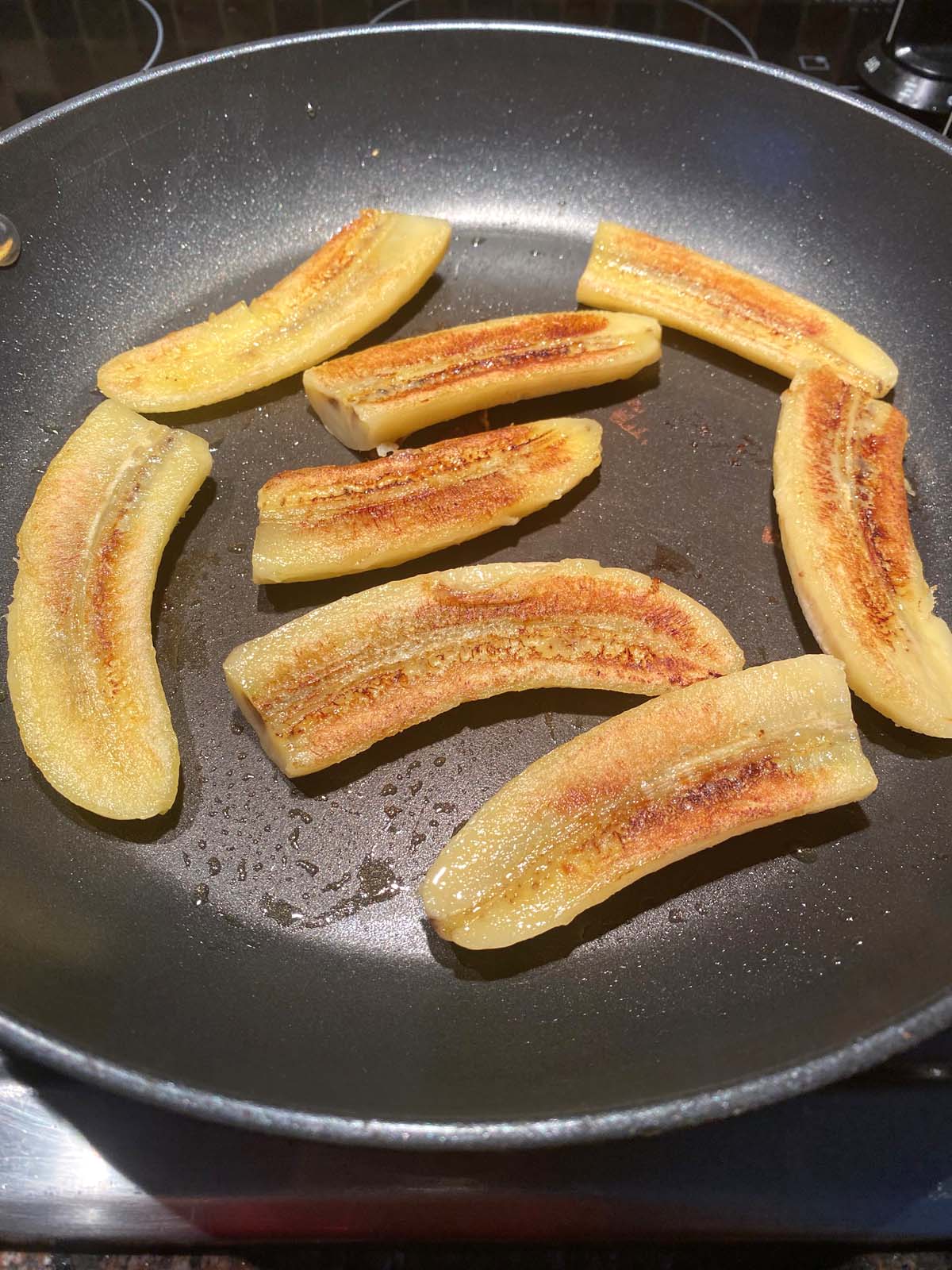 Fried bananas in a frying pan.